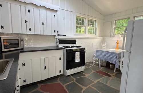 Cotuit House | Beachfront Cape Cod Cottage Overlooking Cotuit Harbor & Walk to Village