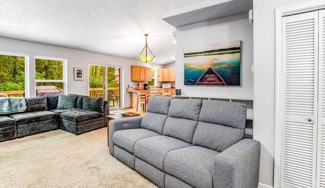 Beautiful home with large deck, gas grill, nestled around the trees