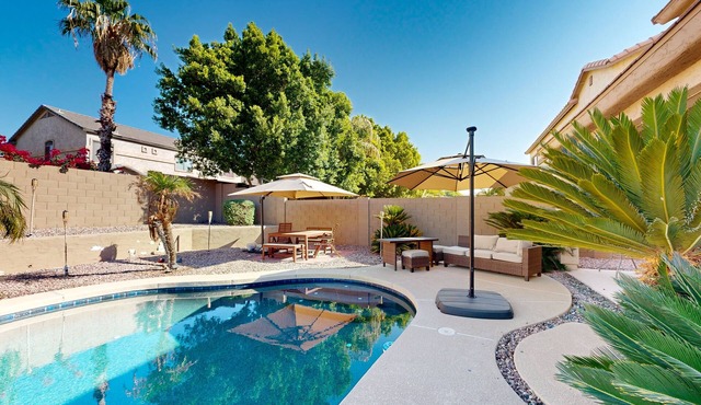 Spacious home surrounded by palms with pool, grill, children's items, & W/D